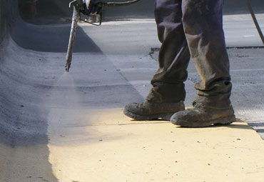 Coating systems over Cambridge spray foam roof systems